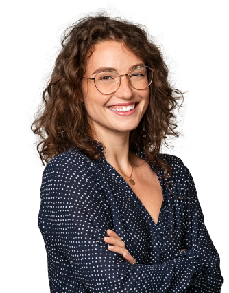Person Standing and smiling with arms folded