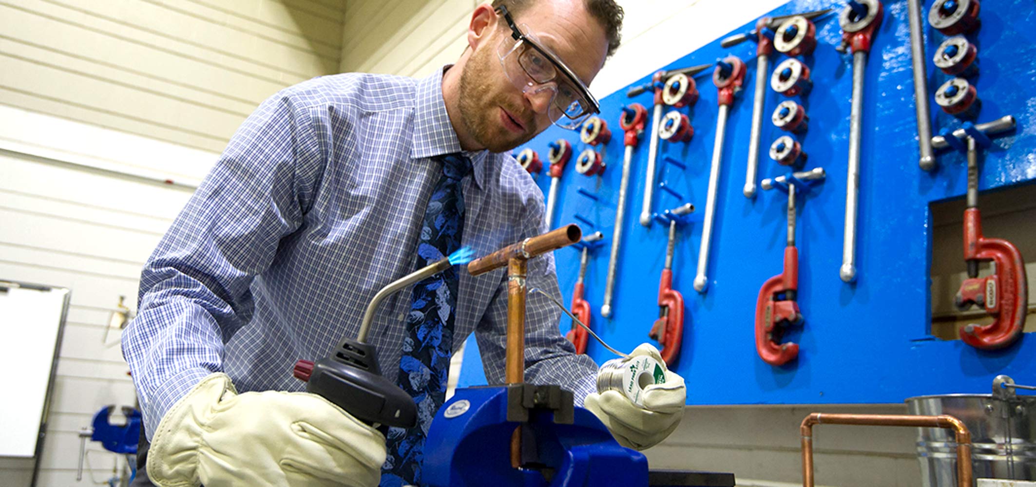 An instructor performing a technical demonstration in one of Keyano College’s workshop facilities.