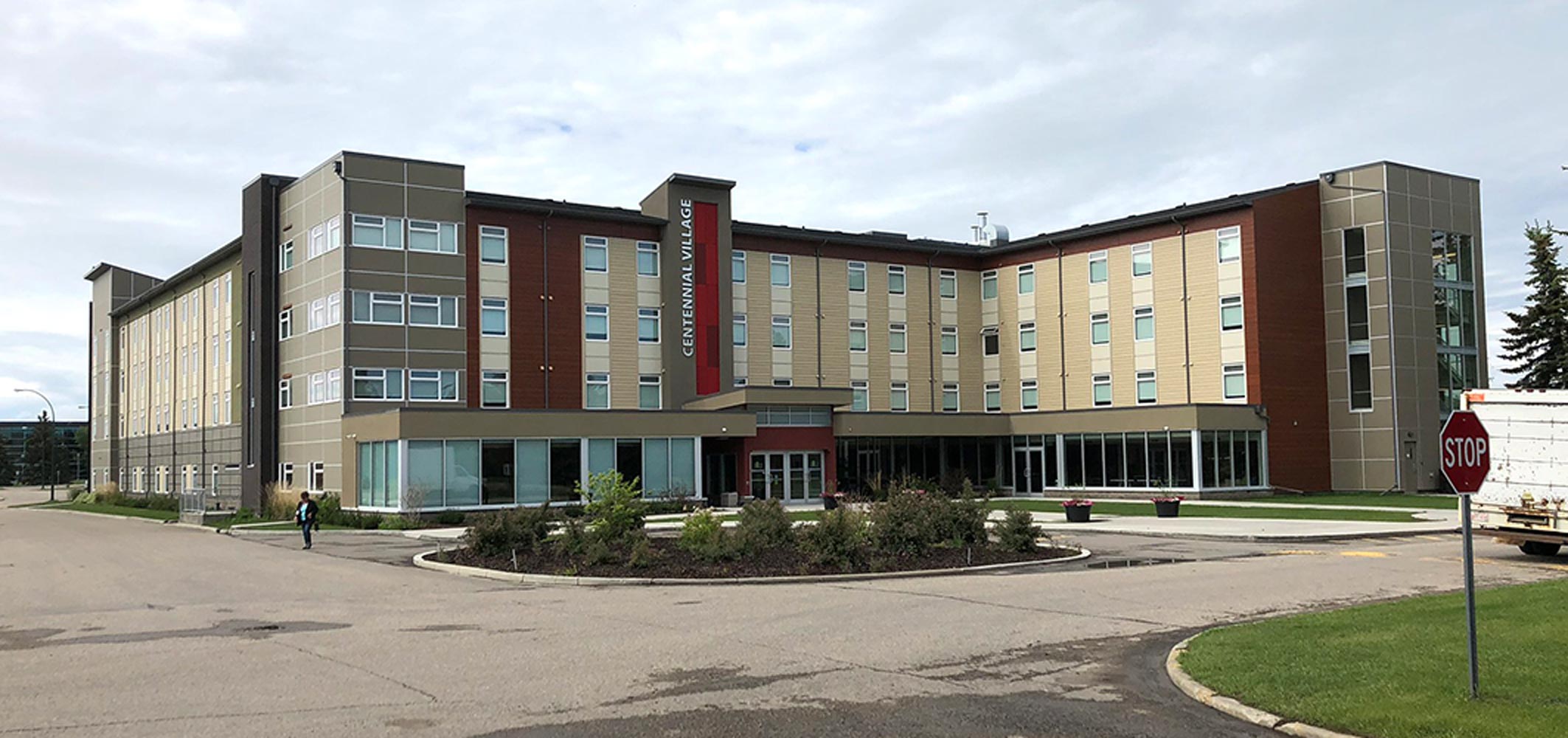 Olds College student leaving the Centennial Village on-campus residences.